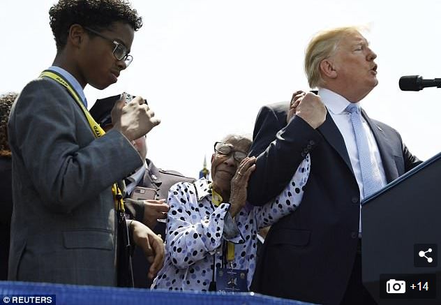 Trump comforts Adrianna Valoy,, mother of police officer Miosotis Familia